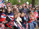 Well wishers with flags and cameras after the Royal Wedding of Prince William to Catherine Middleton at Westminster Abbey.