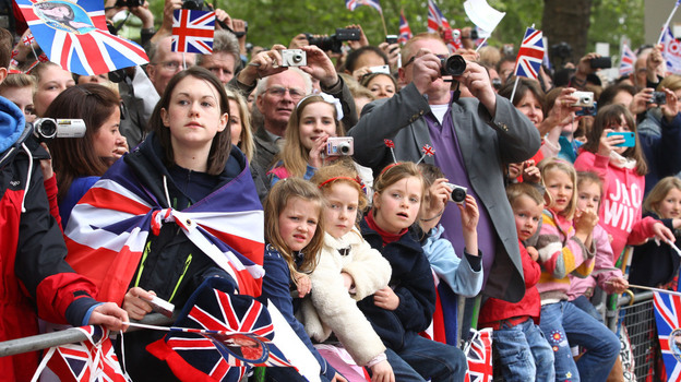 Well wishers with flags and cameras after the Royal Wedding of Prince William to Catherine Middleton at Westminster Abbey.
