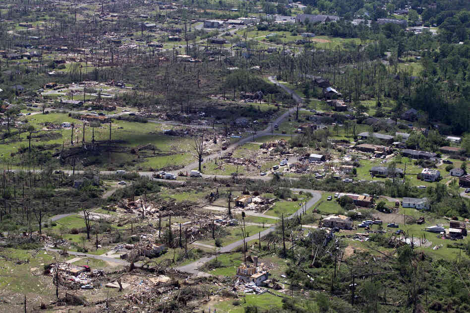 An aerial view shows the tornado damage spread over a half-mile wide path in Pleasant Grove, Ala., Thursday. 