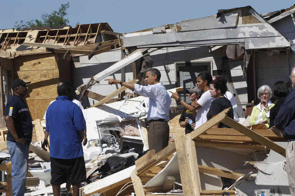 President Obama and first lady Michelle Obama tour tornado damage in Tuscaloosa, Ala., on Friday. 