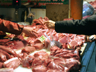 Pork is sold in a market in Beijing. Pork is sold in a market in Beijing.
