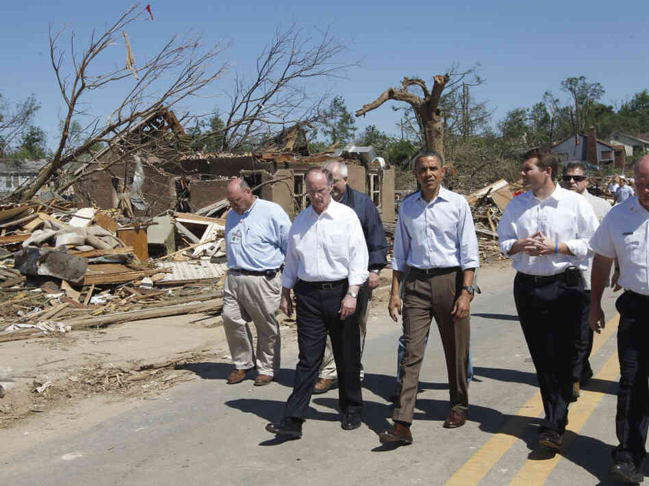 President Obama, flanked by Alabama Gov. Robert Bentley and Tuscaloosa, Ala., Mayor Walter Maddox, tours tornado damage in Tuscaloosa on Friday.