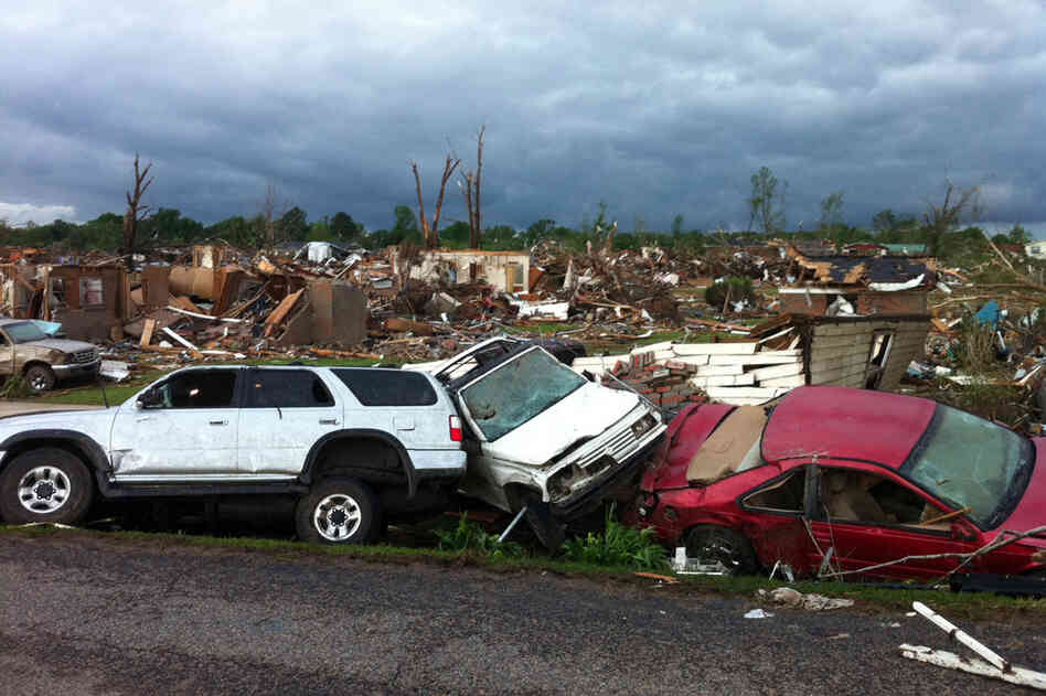 Destroyed cars line the streets of Pleasant Grove. 