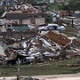 Residents survey the destruction after a tornado hit Pratt City, Ala., on April 27. Short-term forecasting of twisters like the ones that swept the South this week has grown increasingly accurate, but long-term forecasting remains highly unreliable.
