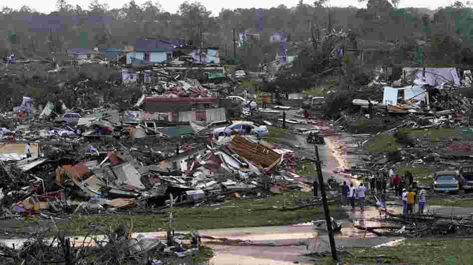 Residents survey the destruction after a tornado hit Pratt City, Ala., on April 27. Short-term forecasting of twisters like the ones that swept the South this week has grown increasingly accurate, but long-term forecasting remains highly unreliable. Residents survey the destruction after a tornado hit Pratt City, Ala., on April 27. Short-term forecasting of twisters like the ones that swept the South this week has grown increasingly accurate, but long-term forecasting remains highly unreliable.