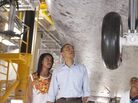 Astronaut Janet Kavandi, director of Flight Crew Operations for Johnson Space Center, leads President Barack Obama, First Lady Michelle Obama and daughters Sasha and Malia, as they view the front landing gear of Space Shuttle Atlantis. Astronaut Janet Kavandi, director of Flight Crew Operations for Johnson Space Center, leads President Barack Obama, First Lady Michelle Obama and daughters Sasha and Malia, as they view the front landing gear of Space Shuttle Atlantis.