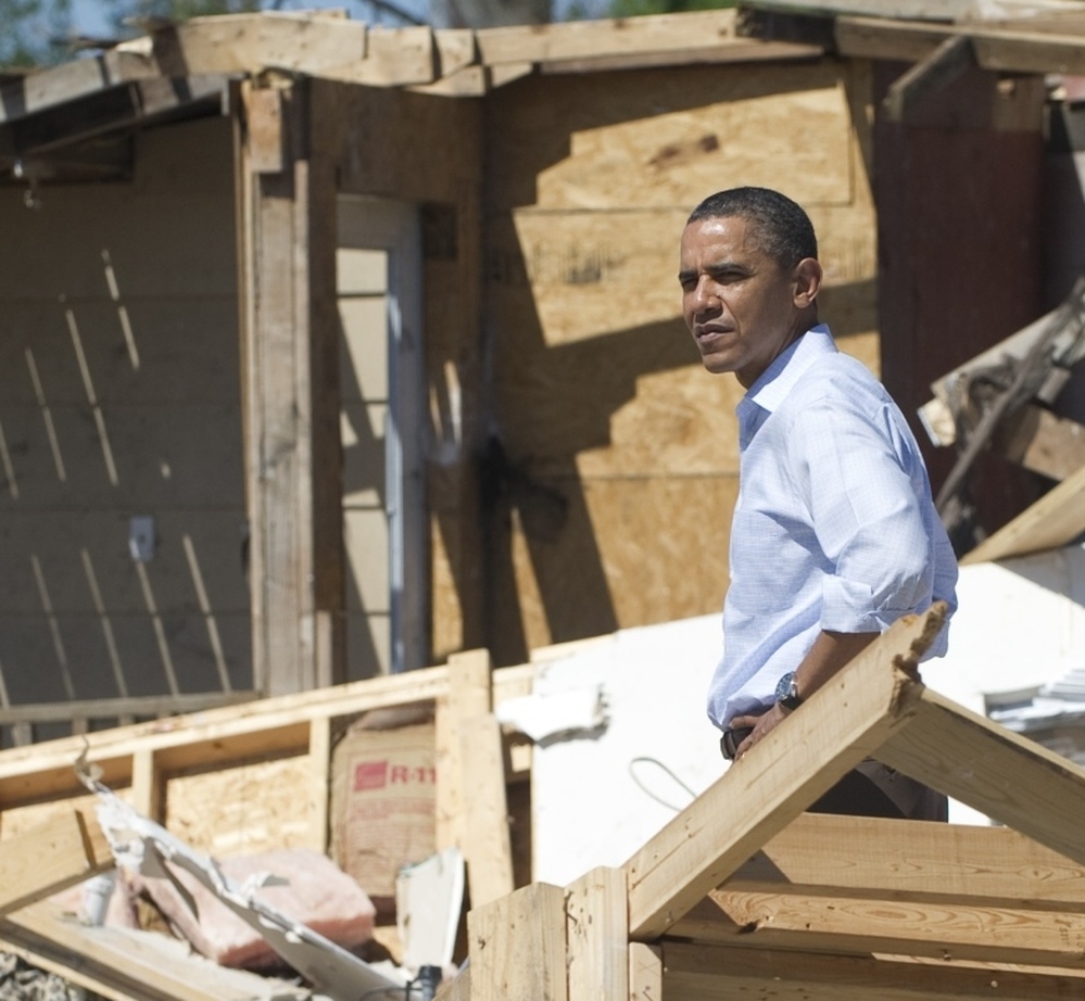 President Barack Obama toured tornado damage in Tuscaloosa, Ala. Obama walked through piles of splintered debris.