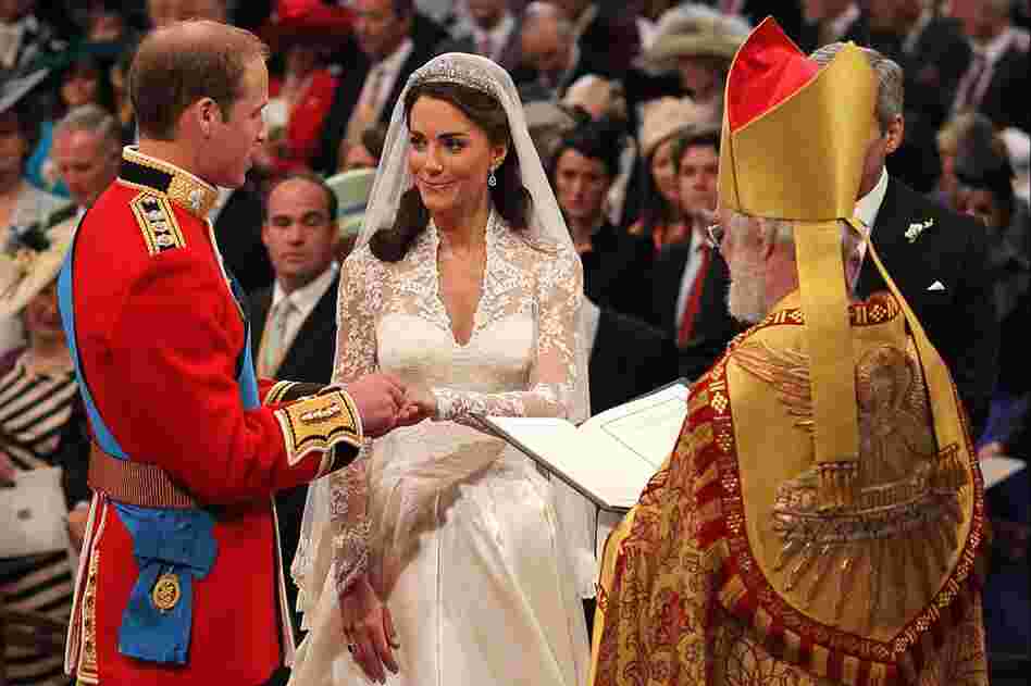 Prince William exchanges rings with his bride in front of the Archbishop of Canterbury, Rowan Williams. 