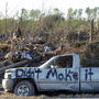 A damaged truck in a tornado-ravaged area near Rainsville, Ala. A damaged truck in a tornado-ravaged area near Rainsville, Ala.