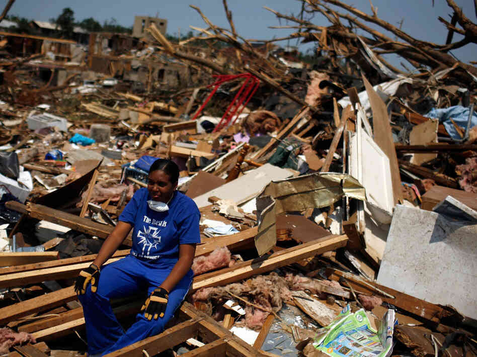 In Tuscaloosa, Ala., on Saturday, LaTia Cobbs sat in the rubble of her destroyed home.