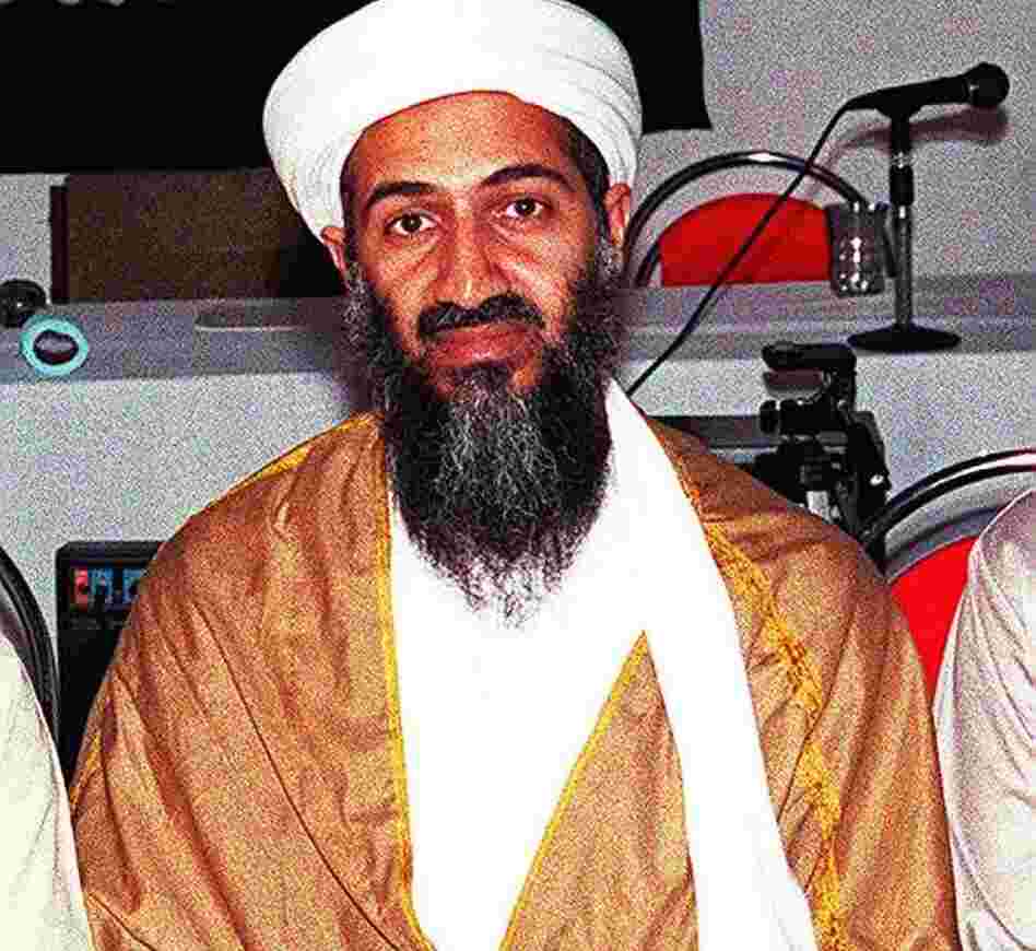 An undated recent picture shows Osama Bin Laden attending a meeting with a Kalashnikov on his lap in an undisclosed place inside Afghanistan