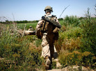 A Bravo Company Marine from Camp Pendleton, Calif., patrols in the Helmand River Valley in southern Afghanistan on Monday. A Bravo Company Marine from Camp Pendleton, Calif., patrols in the Helmand River Valley in southern Afghanistan on Monday.