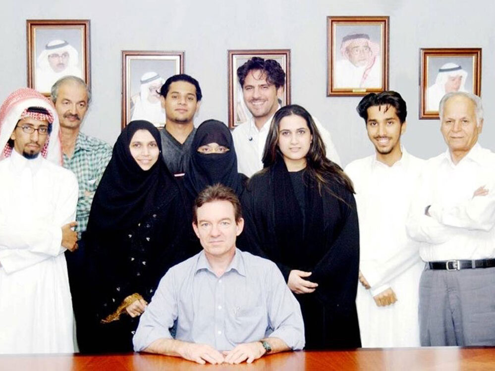 Journalist Lawrence Wright sits with several of the people he interviewed for The Looming Tower, his history of al-Qaida.