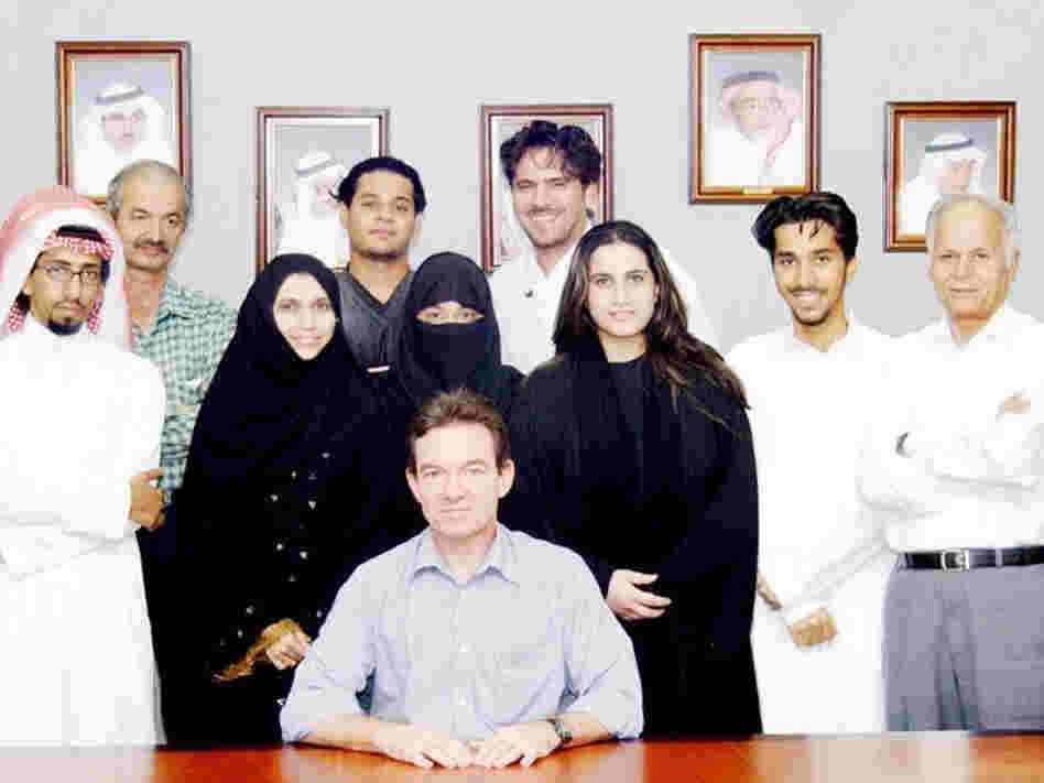 Journalist Lawrence Wright sits with several of the people he interviewed for The Looming Tower, his history of al-Qaida.