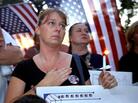 The wife of a victim of the attacks on the World Trade Center attends a candlelight vigil in New York City in 2002. The wife of a victim of the attacks on the World Trade Center attends a candlelight vigil in New York City in 2002.