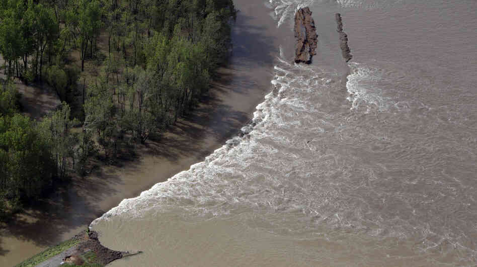 Water flowed through a breach in the Birds Point levee Tuesday in Mississippi County, Mo., after the U.S. Army Corps of Engineers blasted open a 2-mile hole Monday night. Water flowed through a breach in the Birds Point levee Tuesday in Mississippi County, Mo., after the U.S. Army Corps of Engineers blasted open a 2-mile hole Monday night.