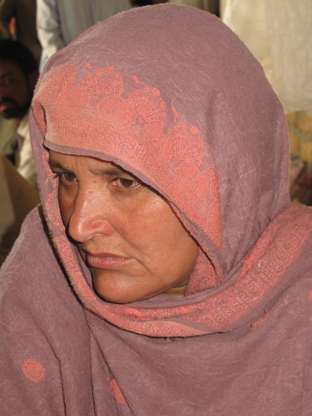 Nasim Bibi lives with 12 members of her family in a home her husband built just a few steps in front of the compound where Osama bin Laden holed up in the garrison city of Abbottabad. Shortly after the U.S. raid, she says security forces came to take her husband, whom she hasn't seen or heard from since.