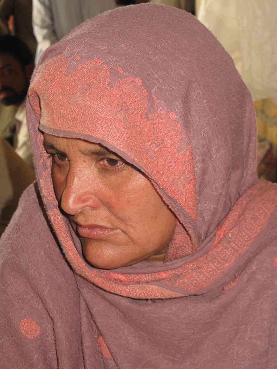Nasim Bibi lives with 12 members of her family in a home her husband built just a few steps in front of the compound where Osama bin Laden holed up in the garrison city of Abbottabad. Shortly after the U.S. raid, she says security forces came to take her husband, whom she hasn't seen or heard from since.