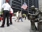 An American flag was placed on a statue near Ground Zero memorializing 9-11, May 3, 2011. An American flag was placed on a statue near Ground Zero memorializing 9-11, May 3, 2011.