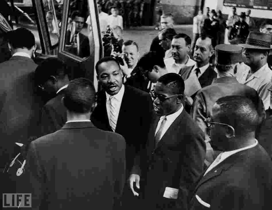 Martin Luther King Jr. (center) sees off a new group of Freedom Riders as they board a bus for Jackson, Miss., on May 24, 1961. 