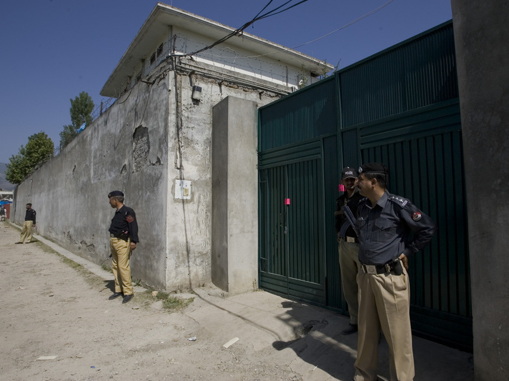 Pakistani police guard the gate of the compound where Osama bin Laden was killed by U.S. forces.
