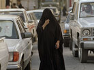 A Saudi woman crosses in front of several automobiles in a marketplace on Sept. 16, 1990, in Dammam. Women in Saudi Arabia are not allowed to drive, have little say in matters of marriage and divorce, and cannot travel without a letter of permission from their male guardian. A Saudi woman crosses in front of several automobiles in a marketplace on Sept. 16, 1990, in Dammam. Women in Saudi Arabia are not allowed to drive, have little say in matters of marriage and divorce, and cannot travel without a letter of permission from their male guardian.