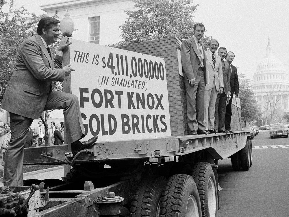 Texas Republican Rep. Ron Paul (fourth from right), Idaho Republican Rep. George Hansen (left) and other members of Congress gather around a truck loaded with 44,300 simulated gold bricks on April 25, 1979, in Washington to indicate their opposition to the estimated $4.1 billion it would cost U.S. taxpayers to give away the Panama Canal.