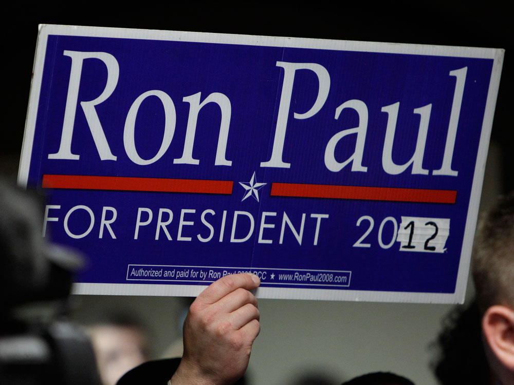 A supporter holds a sign as Paul speaks in Des Moines, Iowa, in April.