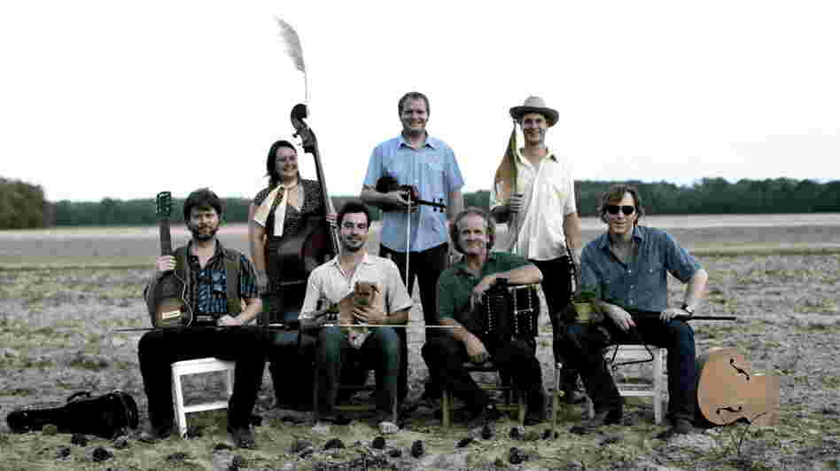 Joel Savoy (bottom, center-left) and Jesse Lége (bottom, center-right) teamed up with a group of Oregon-based musicians to create the Cajun Country Revival. Foghorn Stringband leader Caleb Klauder is at bottom right.