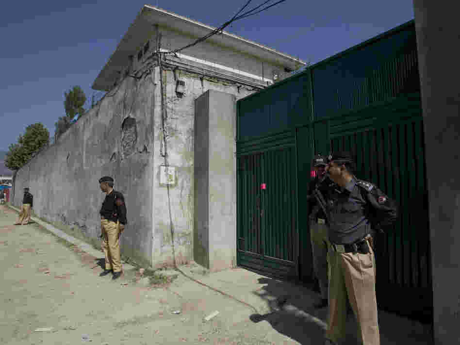 Pakistani police guard the gate of the compound where Osama bin Laden was killed by U.S. forces.