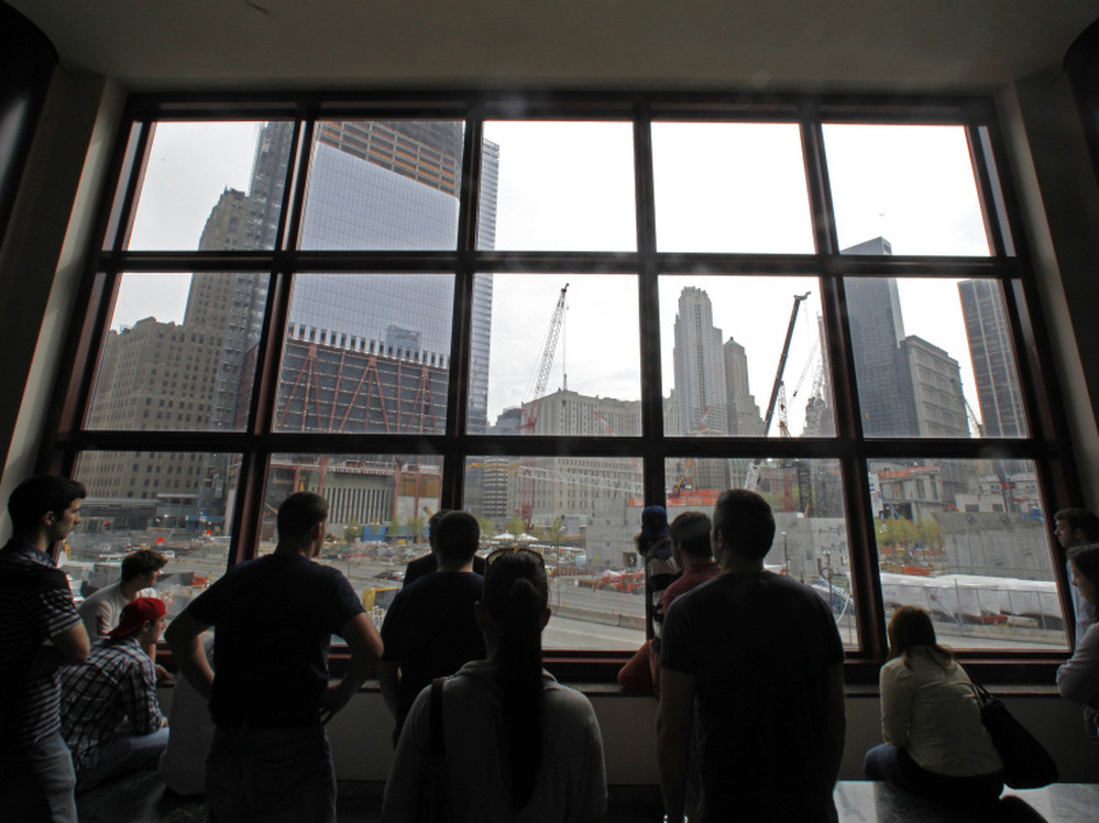In the aftermath of the death of Osama bin Laden, the architect of the Sept. 11 attacks, visitors view the World Trade Center construction site from the World Financial Center building.