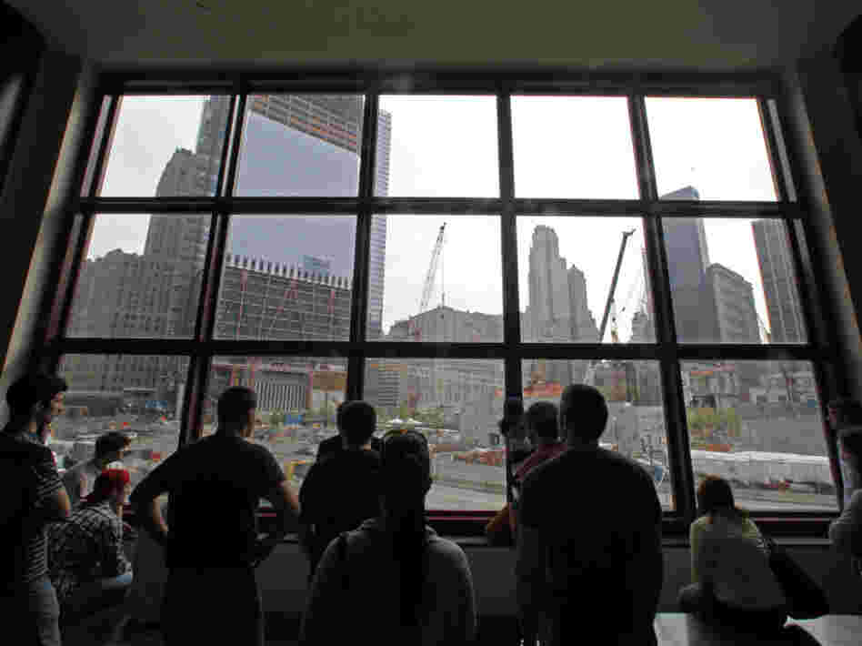 In the aftermath of the death of Osama bin Laden, the architect of the Sept. 11 attacks, visitors view the World Trade Center construction site from the World Financial Center building.