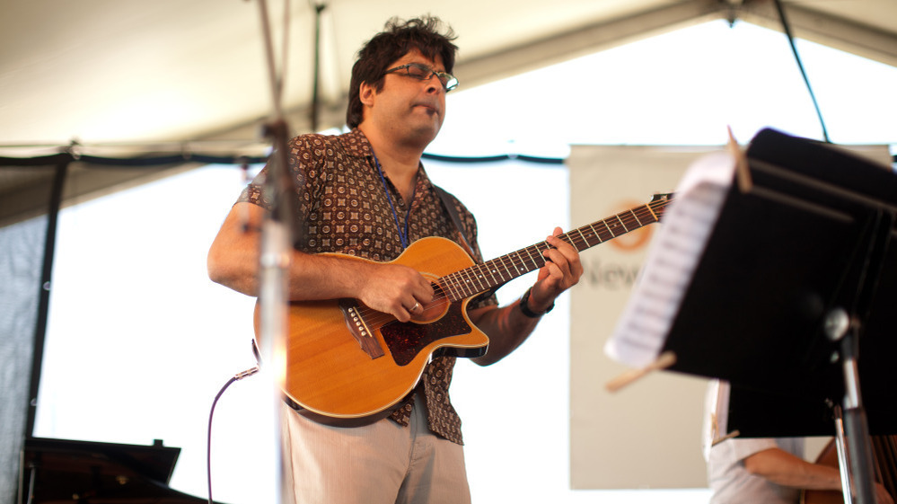 Rez Abbasi performs at the Newport Jazz Festival.