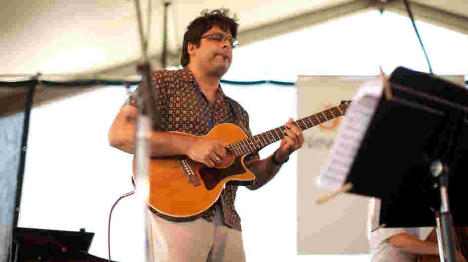 Rez Abbasi performs at the Newport Jazz Festival.