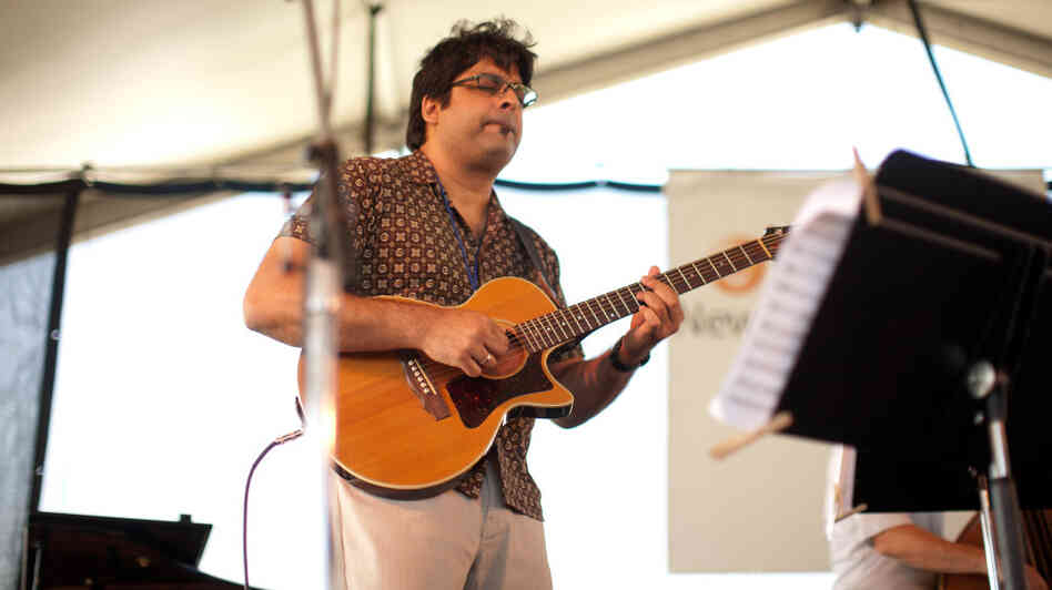 Rez Abbasi performs at the Newport Jazz Festival.