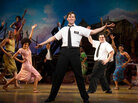The Book of Mormon features music and lyrics by Trey Parker, Robert Lopez and Matt Stone and plays at the Eugene O'Neill Theatre in New York City. The Book of Mormon features music and lyrics by Trey Parker, Robert Lopez and Matt Stone and plays at the Eugene O'Neill Theatre in New York City.
