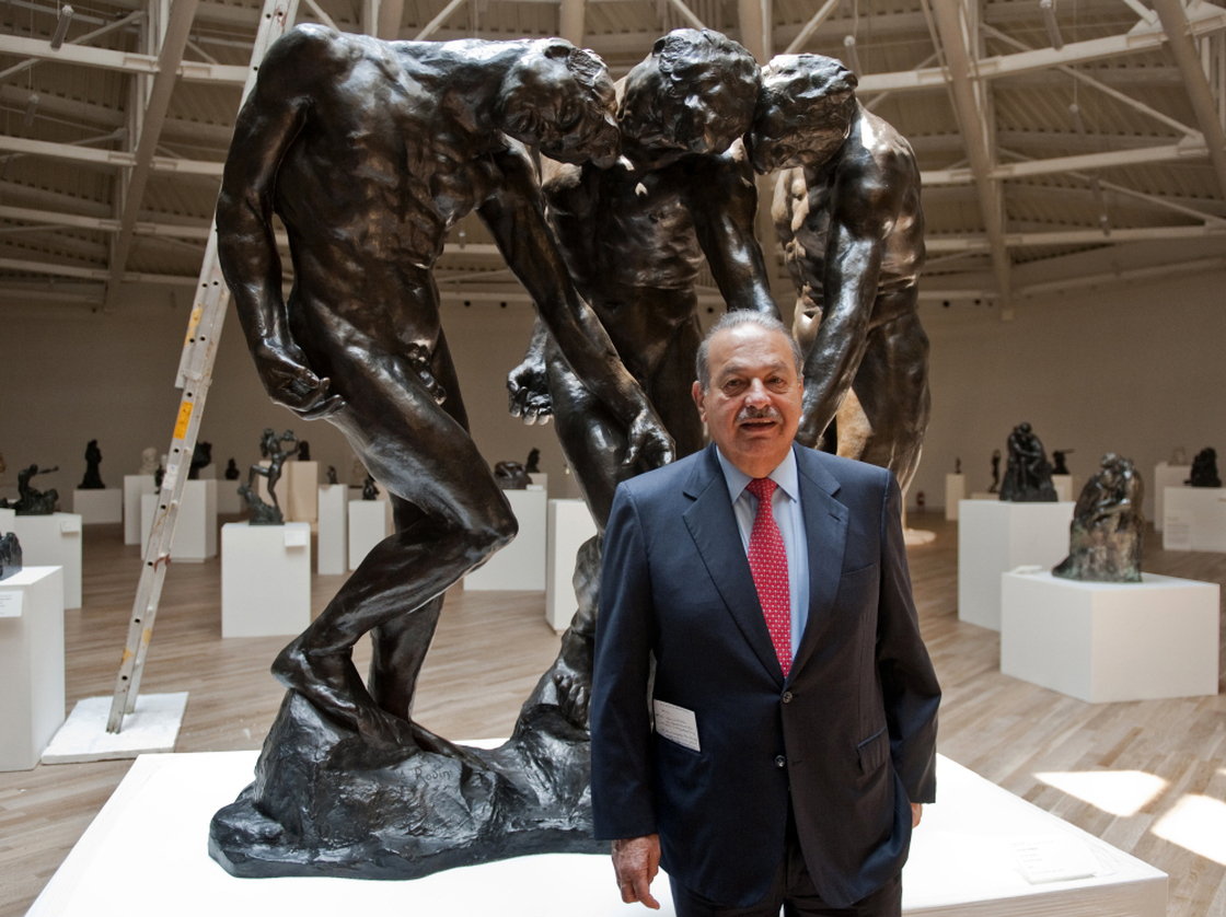 Carlos Slim invested more than $800 million in the Soumaya Museum, the second museum opened by the telecommunications mogul. Here, he stands with Auguste Rodin's The Three Shades on March 28, the eve of the opening.