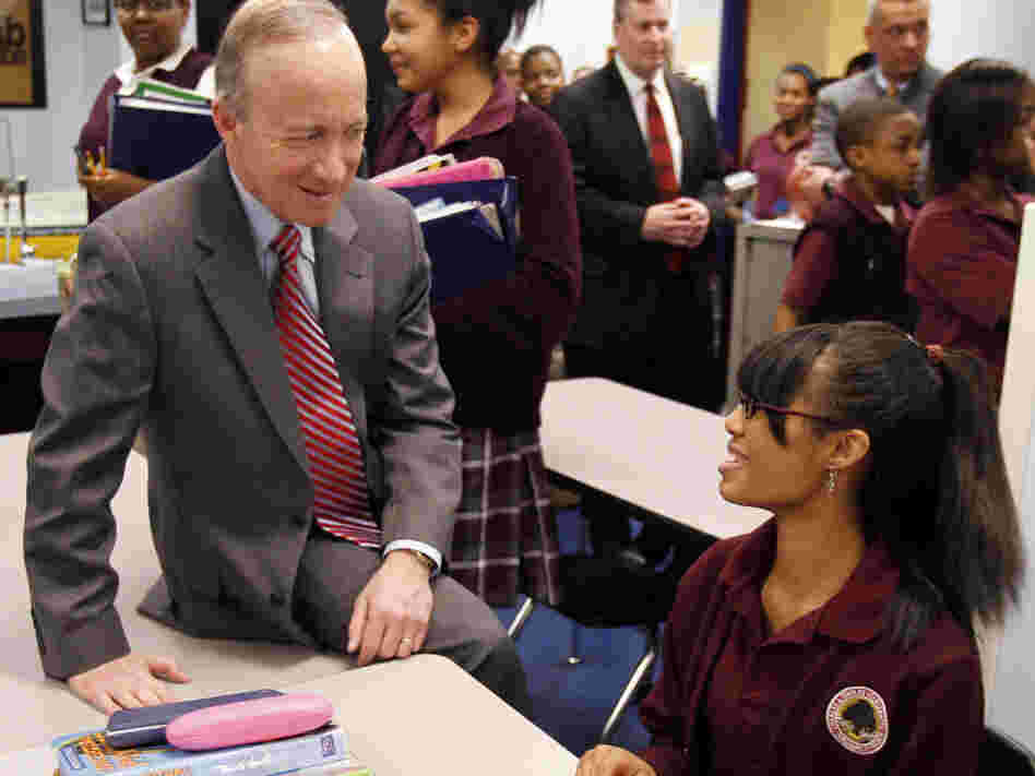 Indiana Gov. Mitch Daniels talks with student Cree DeDeaux, 14, during a tour of an Indianapolis school. Indiana recently expanded its school voucher program, making  it one of the most extensive in the nation.