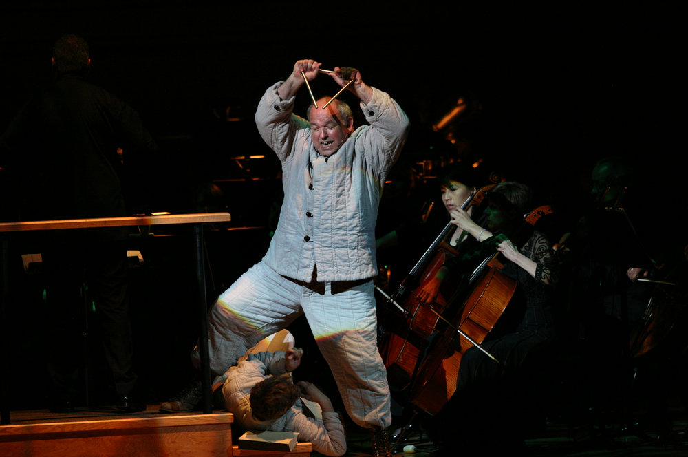 David De Christopher, center, with Pete Cross, (lying down), performing "Every Good Boy Deserves Favour" by Tom Stoppard and Andre Previn during the Toledo Symphony with Stefan Sanderling, Principal Conductor during the second half of the Spring for Music festival at Carnegie Hall in Manhattan, New York on May 07, 2011.  
