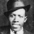 One of the two known photos of Robert Johnson. This portrait was taken by the Hooks Bros. Photography Company in Memphis, Tenn., circa 1935. One of the two known photos of Robert Johnson. This portrait was taken by the Hooks Bros. Photography Company in Memphis, Tenn., circa 1935.