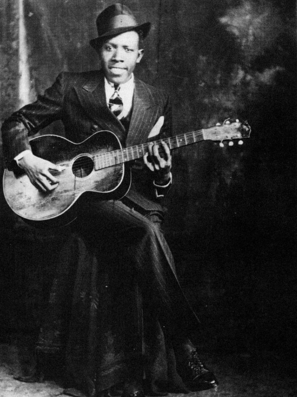 One of the two known photos of Robert Johnson. This portrait was taken by the Hooks Bros. Photography Company in Memphis, Tenn., circa 1935.