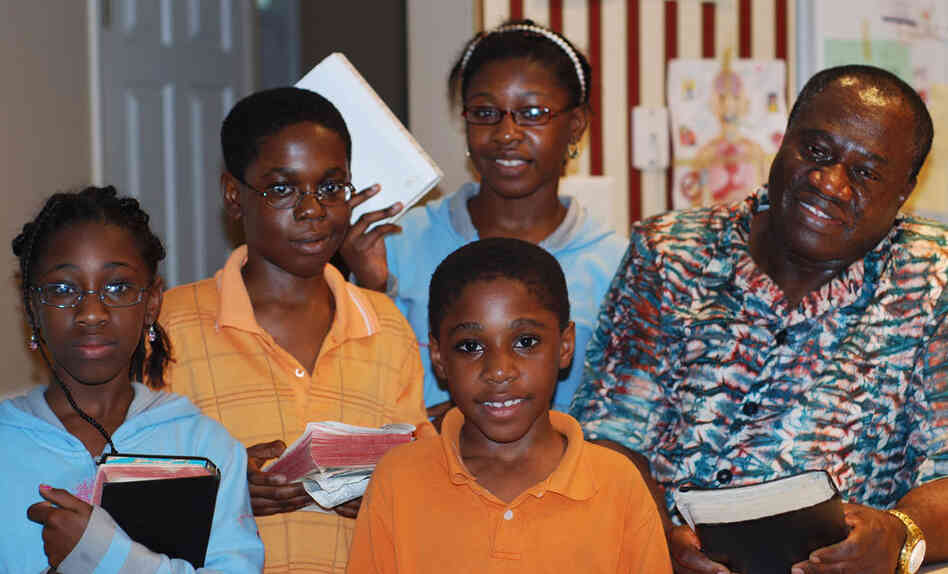Spencer Izuwa Sr. and his children — Rhoda, Spencer Jr., Nina and Richard (from left) — prepare for May 21 as a family. 