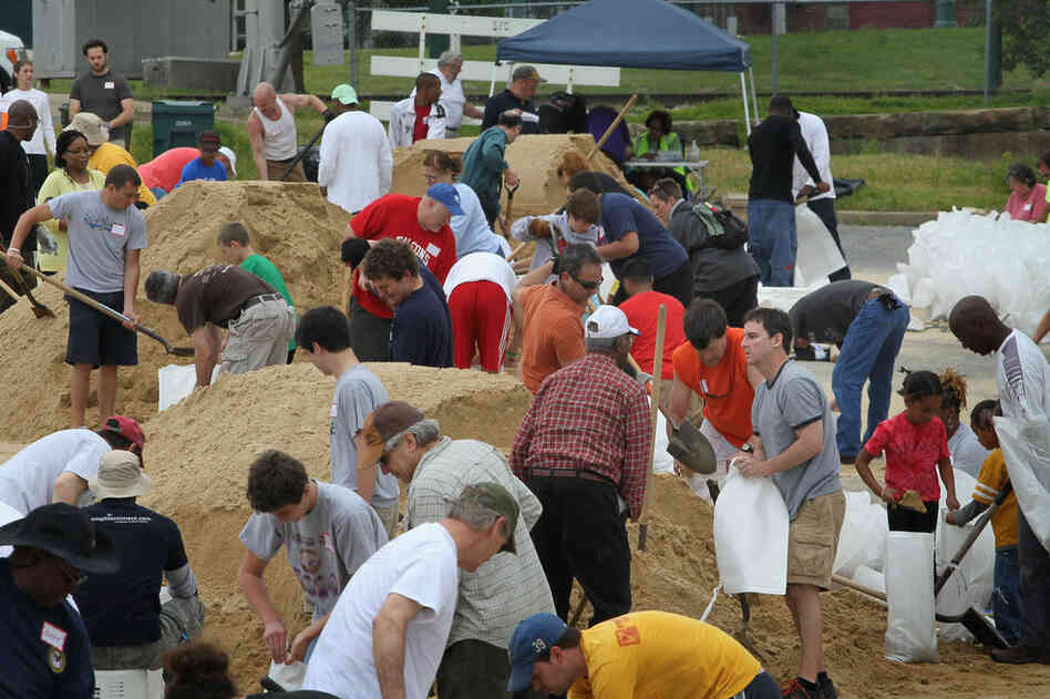 MAY 8: Volunteers in Memphis fill sandbags to help hold back rising floodwater. 