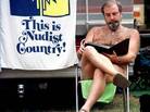 John Kinman, from Kona, Hawaii, sits and goes over papers at the Willamettan nudist camp in Marcola, Ore., Wednesday, Aug. 11, 1999. Many nudist groups now face an aging membership and little interest from younger generations. John Kinman, from Kona, Hawaii, sits and goes over papers at the Willamettan nudist camp in Marcola, Ore., Wednesday, Aug. 11, 1999. Many nudist groups now face an aging membership and little interest from younger generations.