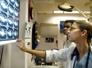 A doctor views CT scans in the emergency room at Coney Island Hospital in New York City. A doctor views CT scans in the emergency room at Coney Island Hospital in New York City.