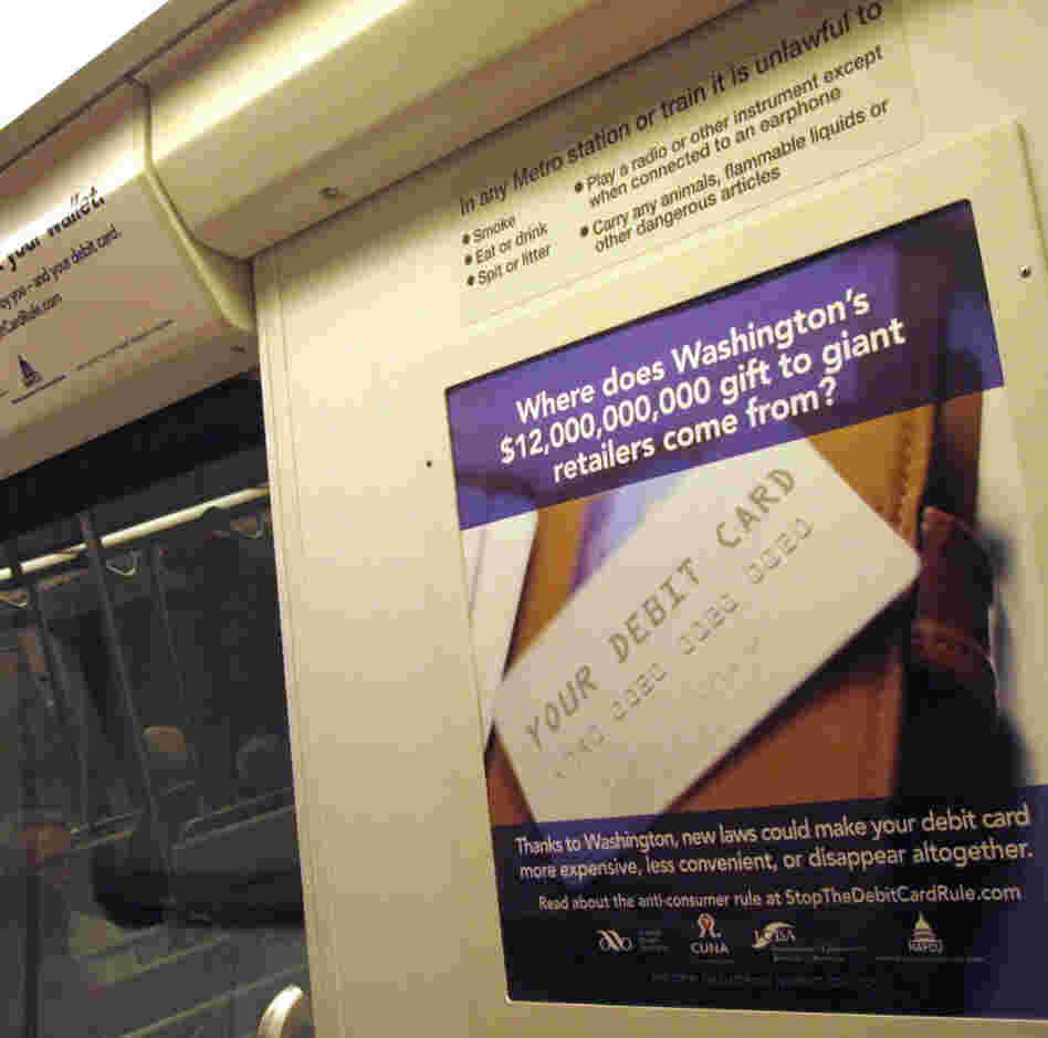 Ads like these — from the Electronic Payments Coalition — appear in about 100 rail cars within the Washington, D.C., Metrorail system.
