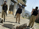 Pakistani military and police officials cordon off a street leading to the final hideout of al-Qaida chief Osama bin Laden in Abbottabad, Pakistan, on Monday (May 9, 2011). Pakistani military and police officials cordon off a street leading to the final hideout of al-Qaida chief Osama bin Laden in Abbottabad, Pakistan, on Monday (May 9, 2011).