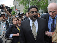 Raj Rajaratnam, the billionaire co-founder of Galleon Group, exits federal court with his attorney, Terence Lynam, in New York on Wednesday.