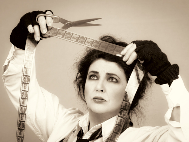 British singer Kate Bush acts out the title to her new album, Director's Cut.