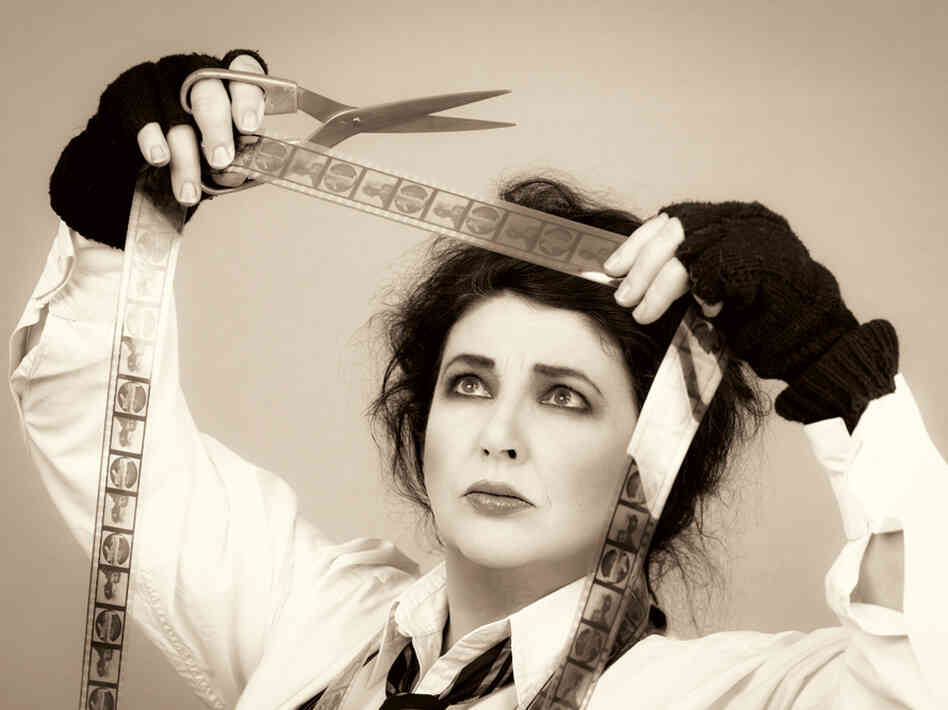 British singer Kate Bush acts out the title to her new album, Director's Cut.